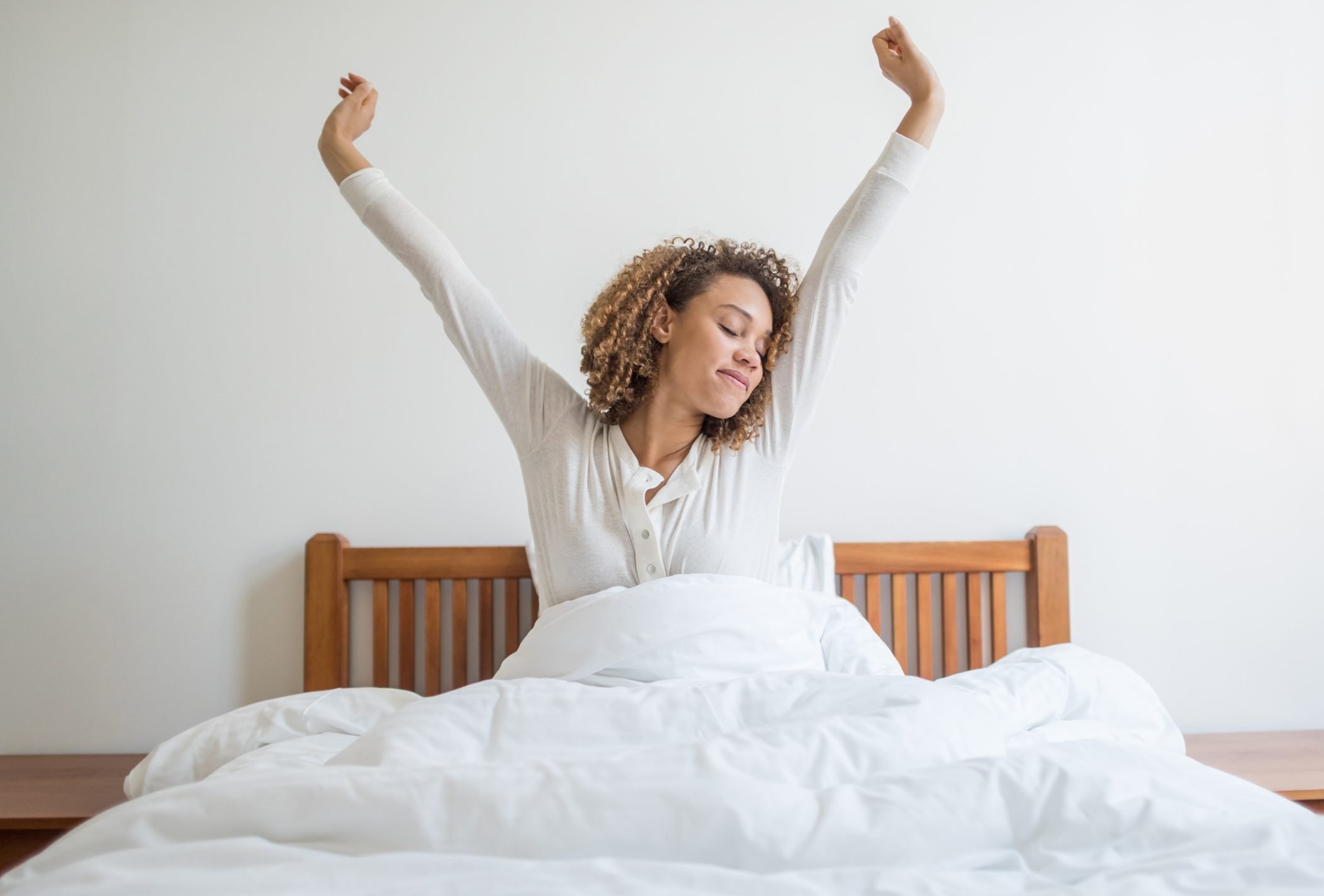 woman waking up in the morning yawning and stretching|senior woman opening window curtains at home|man sleeping in bed, holding his pillow|man taking a nap on couch at home|cropped shot of woman tying sneakers|woman sleeping on her back in bed|smarphone charging on nightstand next to bed