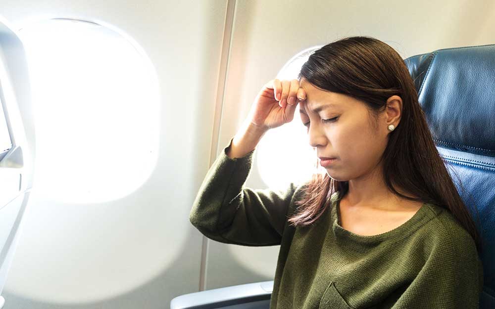 Why You Get a Headache When You Fly—and How You Can Stop It