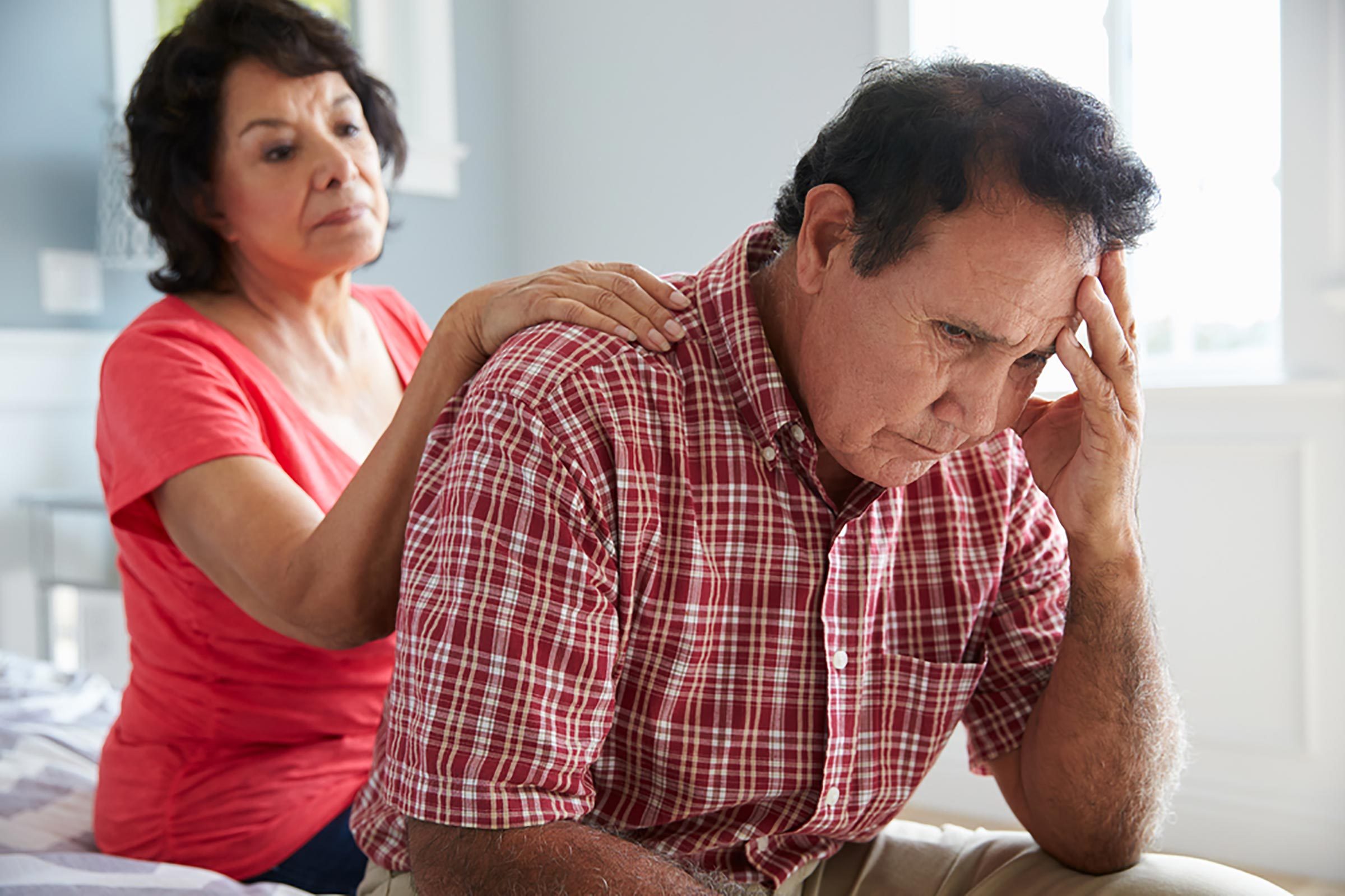 elderly|person looking at x-ray scans of the brain|nurse talking with woman in wheelchair|set of keys on wood table|two older people lifting weights|elderly man holding a pair of shoes |doctor talking to male patient|woman comforting worried man 