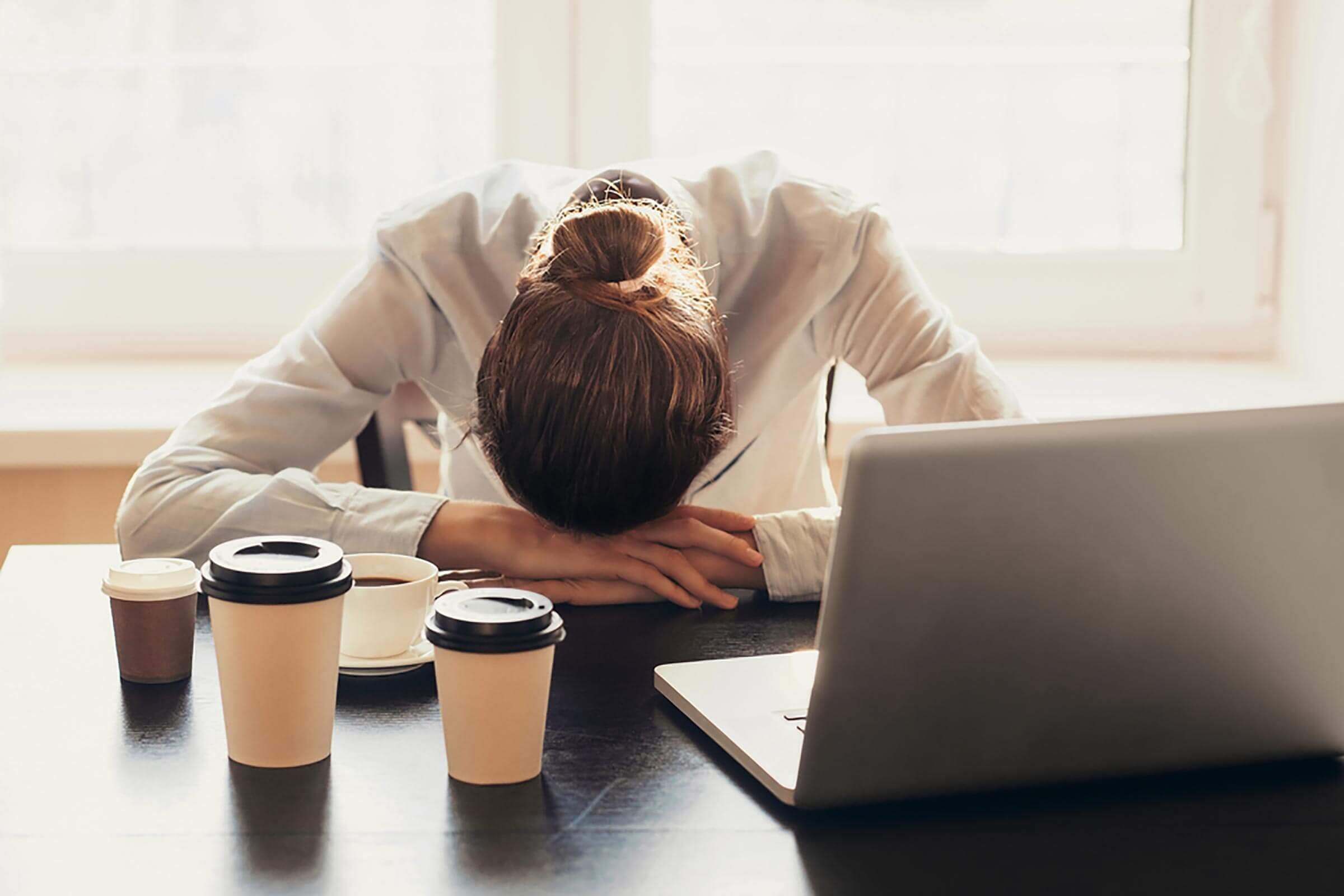 body|Close up of woman with hands in hair with dandruff|Woman with hand in hair|Woman's hair with small amount of gray|Cold sore on lip|goosebumps|fingernail with ridges|Woman at work with head on table surrounded by several cups of coffee|Large bruise on thigh|Runner holding calf |Woman in pain holding her stomach