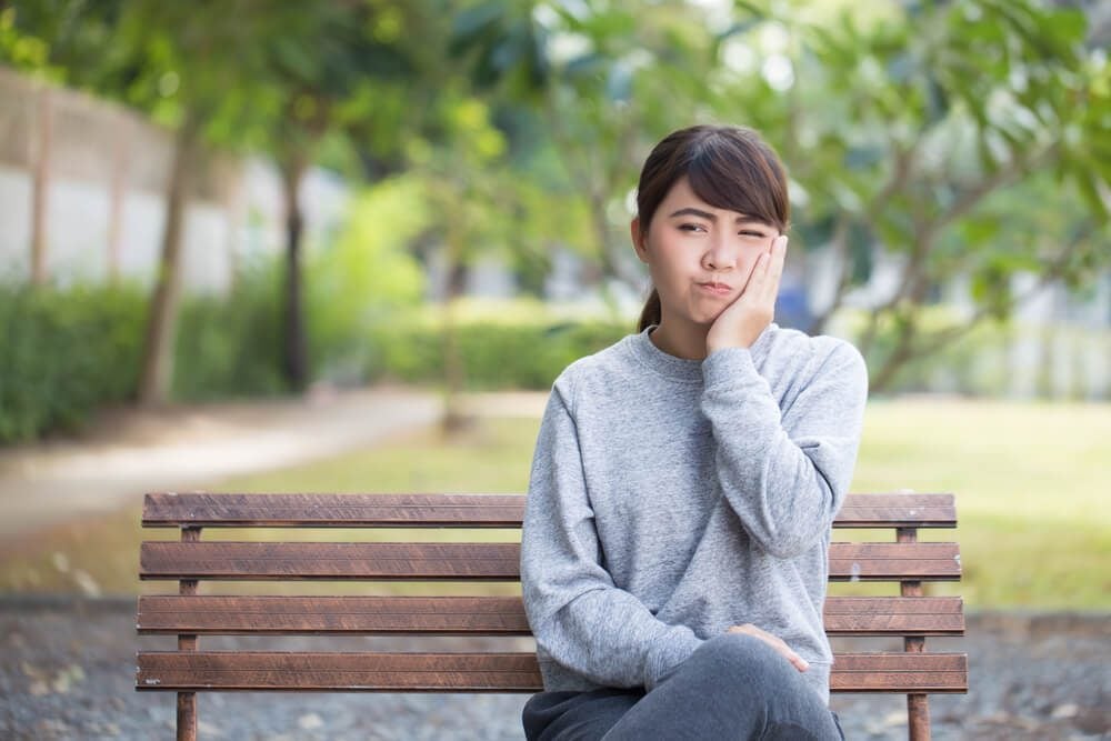 Woman has toothache coppy space