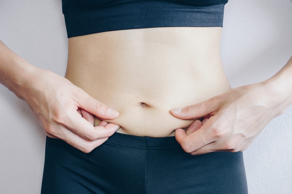 Healthy toned stomach one woman hi-res stock photography and