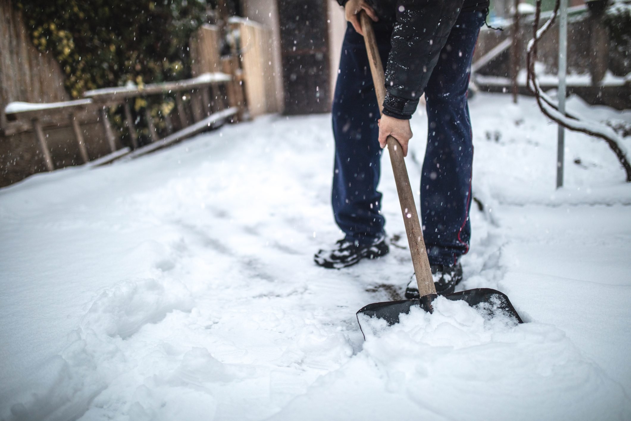 what doctors want you to know about shoveling snow in the winter|shoveling snow|woman looking for food in refrigerator||man prepared to shovel snow in winter|shovel snow frequently|snow shovel on garage door|man using snowblower machine in winter to shovel snow||shoveling snow in the winter burns a lot of calories workout