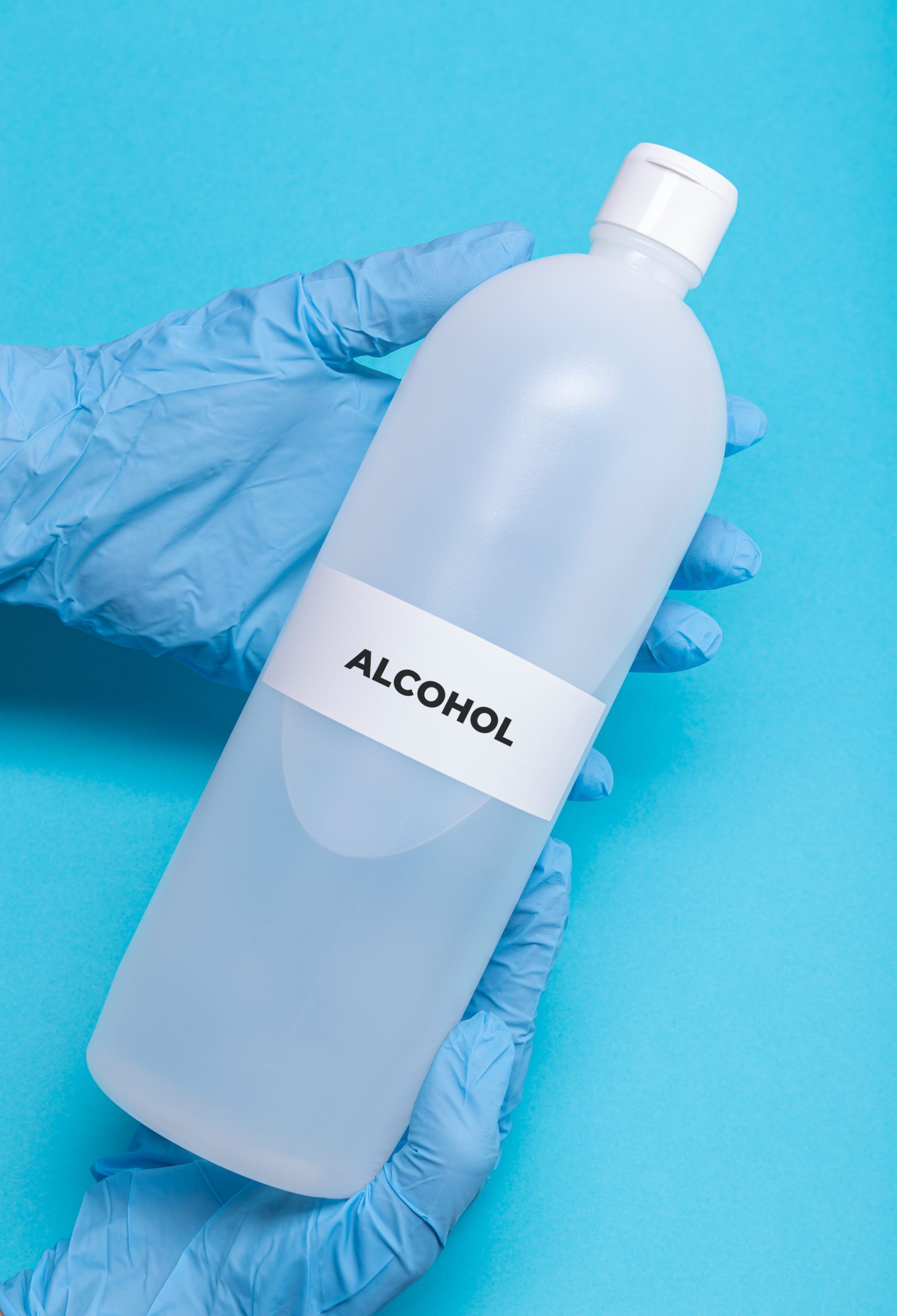 rubbing alcohol bottle on blue background|rubbing alcohol bottle on blue background|little girl getting her ears pierced|bathroom window propped open