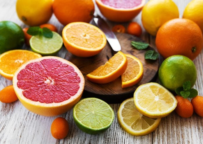 close up of Orange Juice Pouring into a glass|close up of Orange Juice Pouring into a glass|slices of citrus fruits|heart shape on top of Electrocardiograph|orange juice and oranges full frame