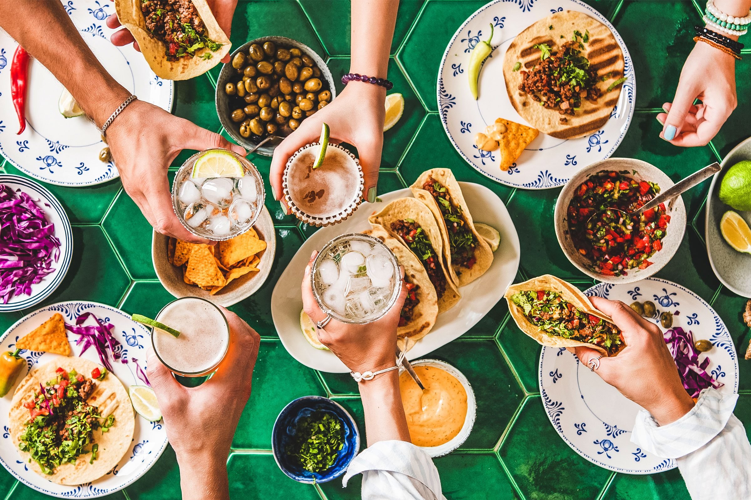 Family Friend Dinner tacos and drinks top view|