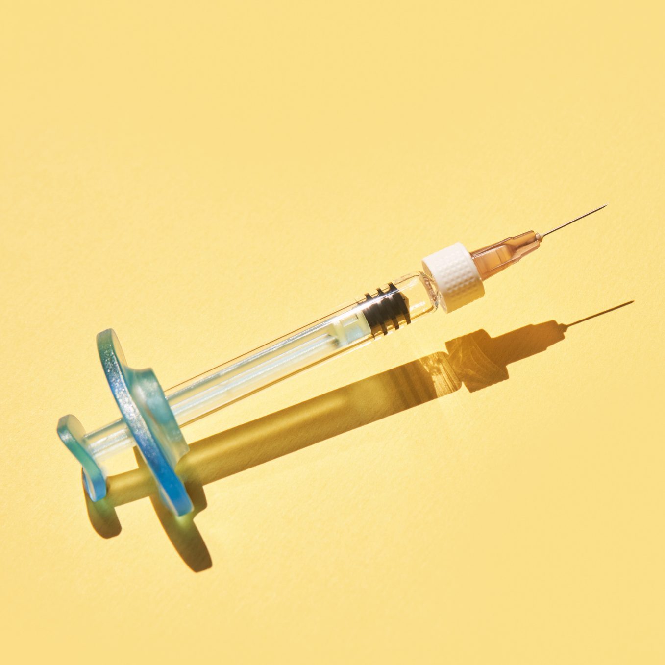 Syringe drug. Doctor injection vaccine. Hard shadow. Healthcare therapy|