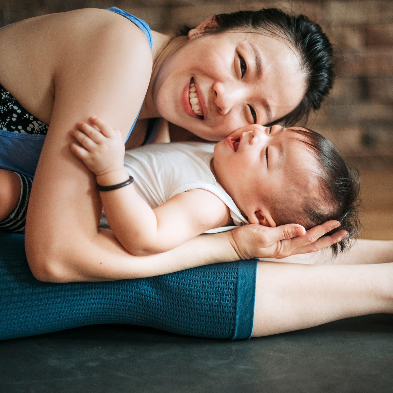 4 Postpartum Yoga Poses To Strengthen Your Core, From a Certified Yoga & Postnatal Instructor