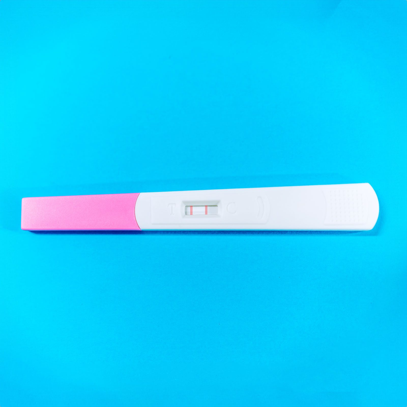 pregnancy test o na blue background|pregnancy test o na blue background