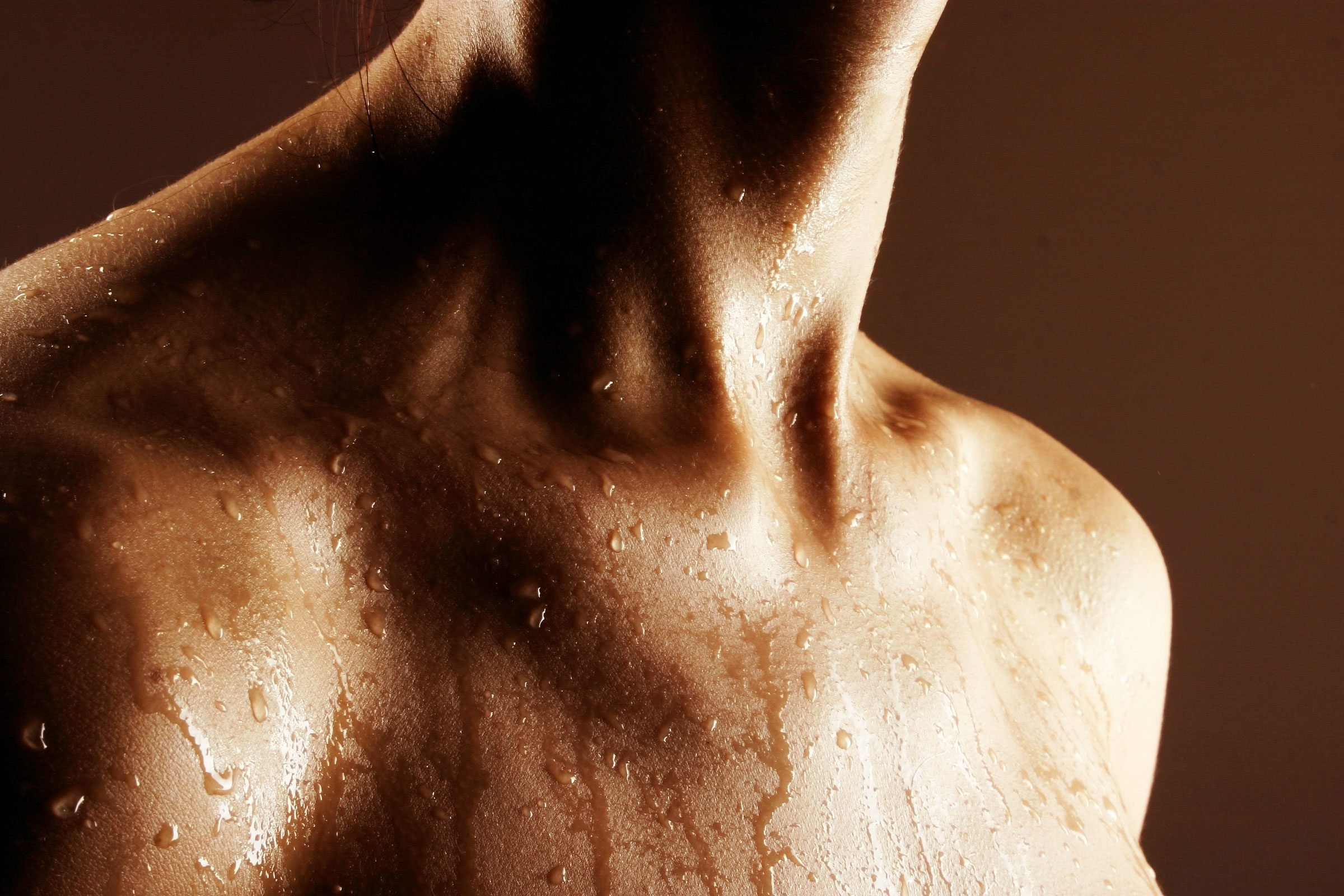 close up of sweat on skin from exercising and burning calories