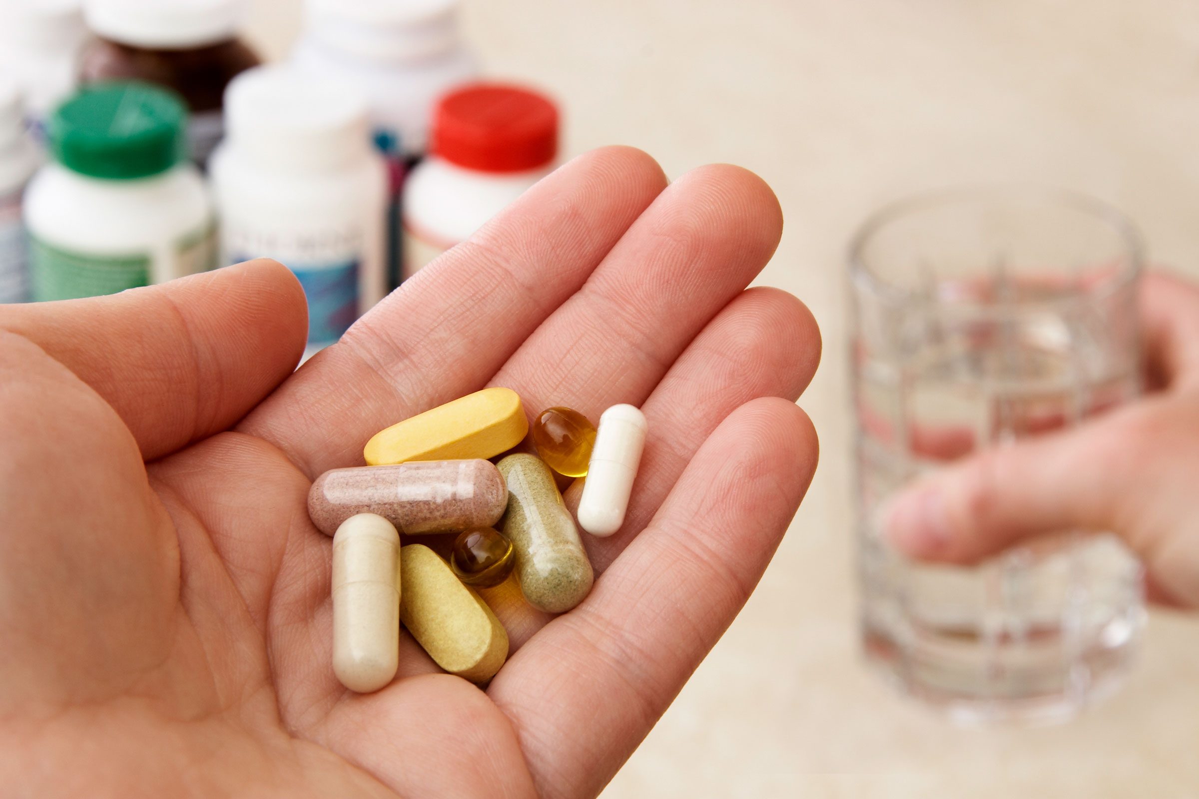 hand holding Vitamins and supplements