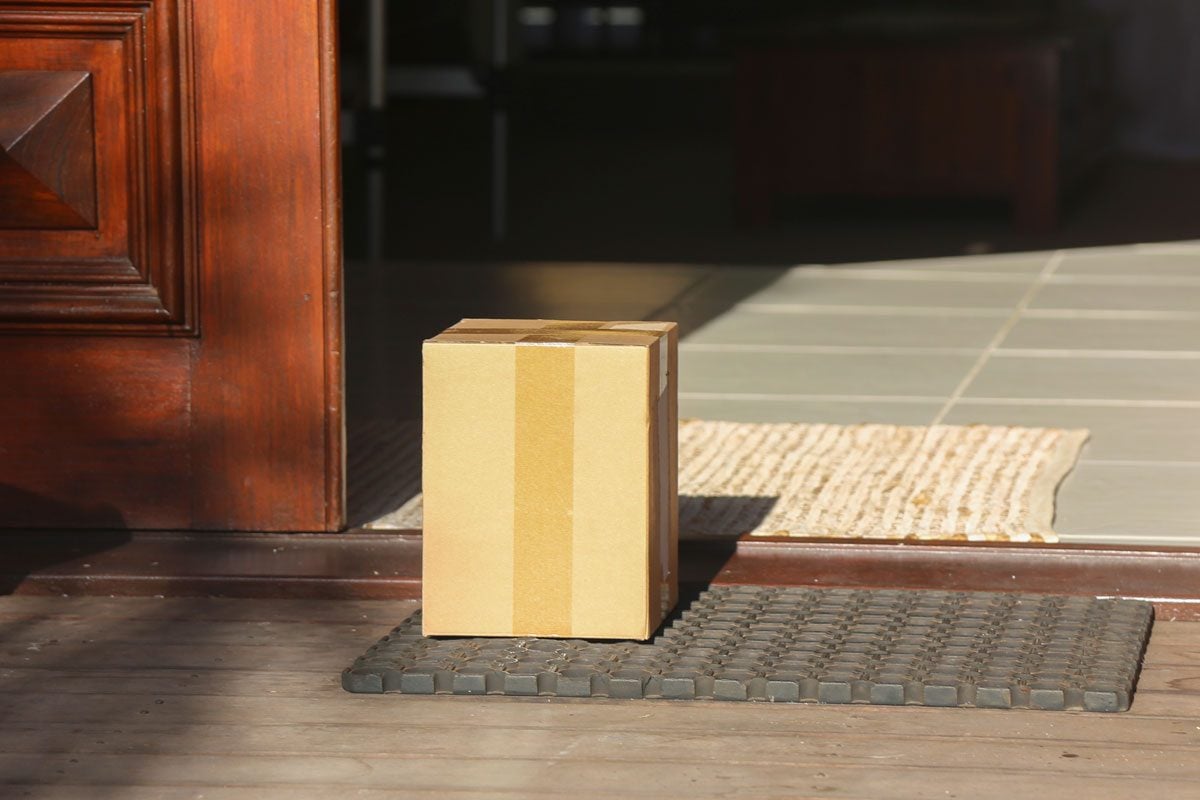 A Delivered Box Left At The Front Door