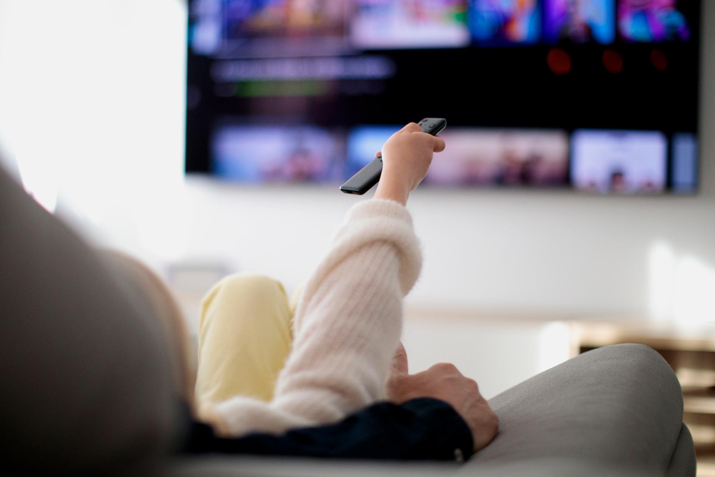 hand holding TV remote