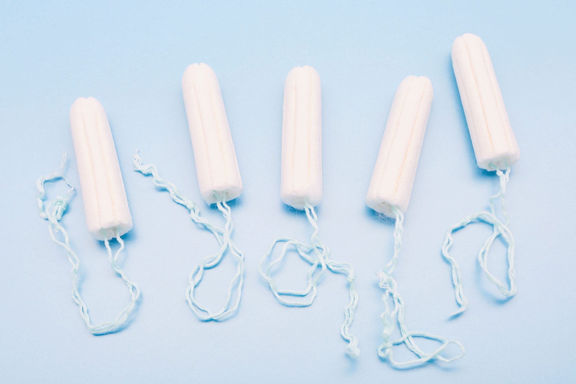 Tampons On Blue Background|