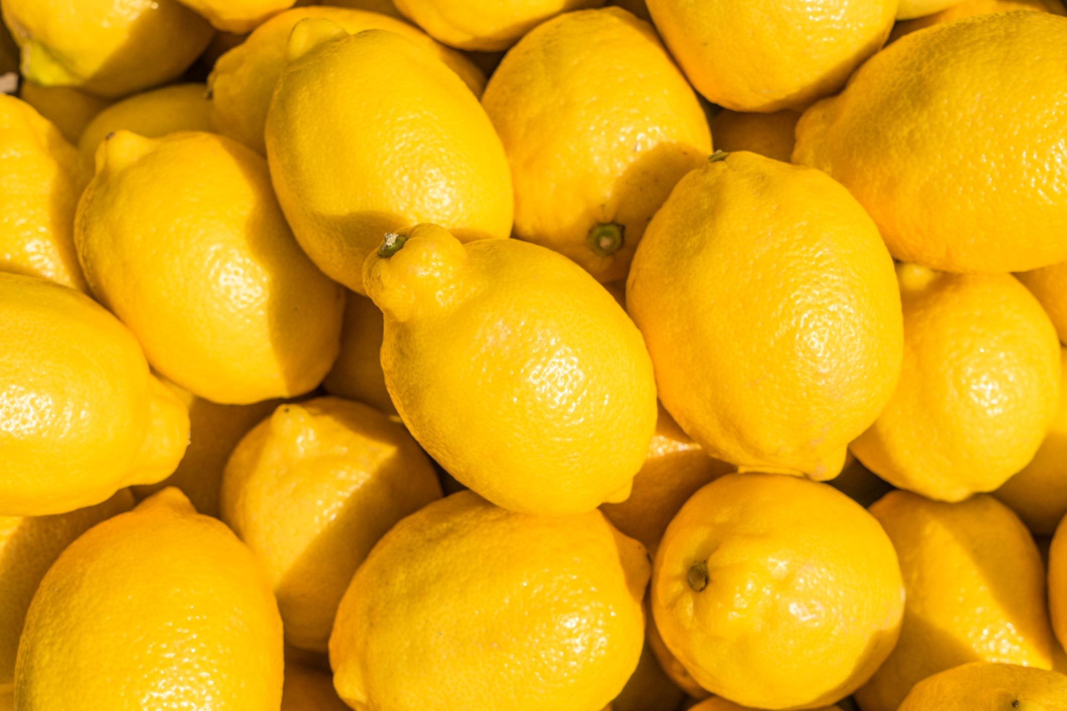 Group of lemon.|two glasses of lemon water on white background