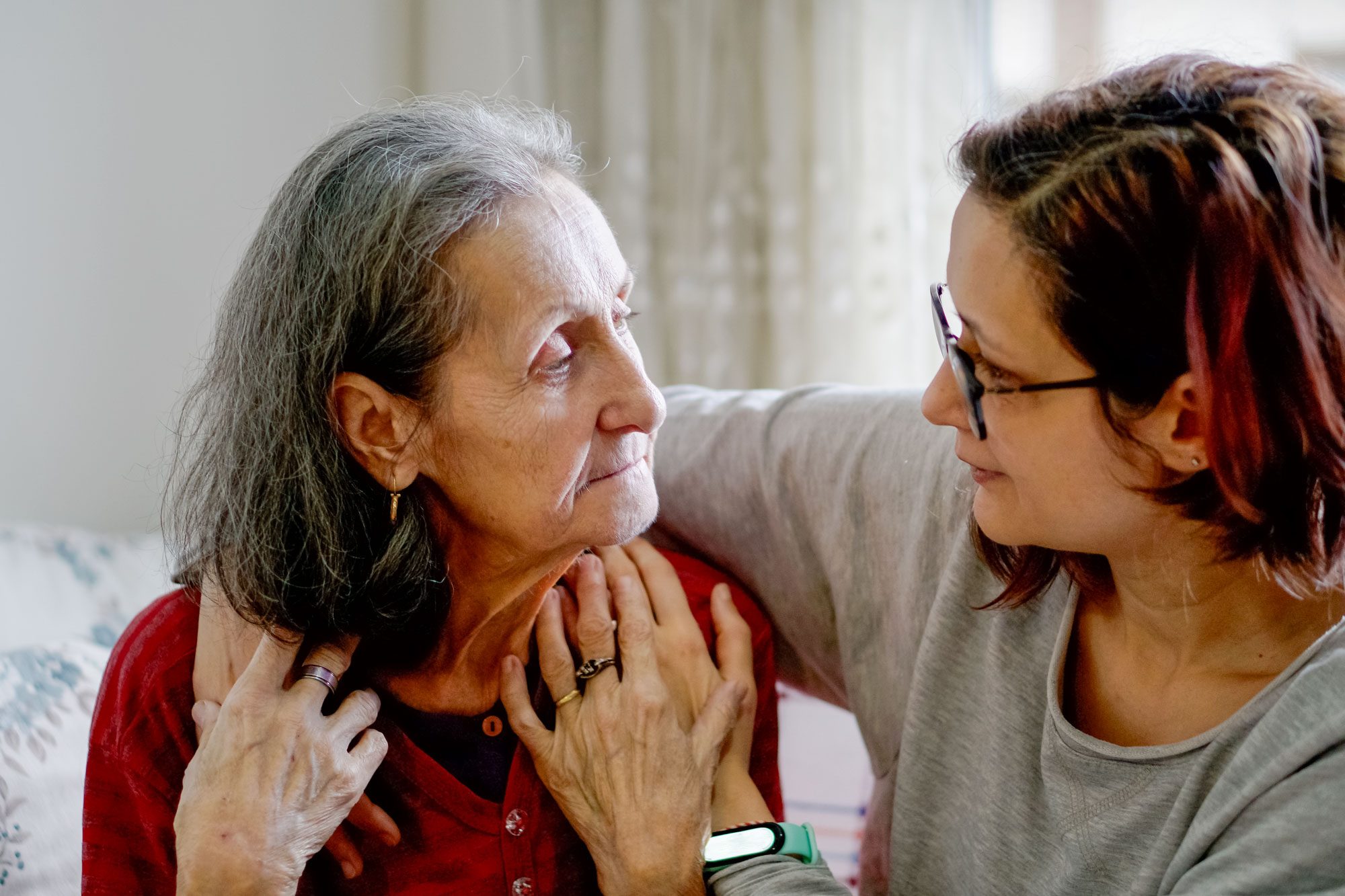 Woman Hugging Her Elderly Mother