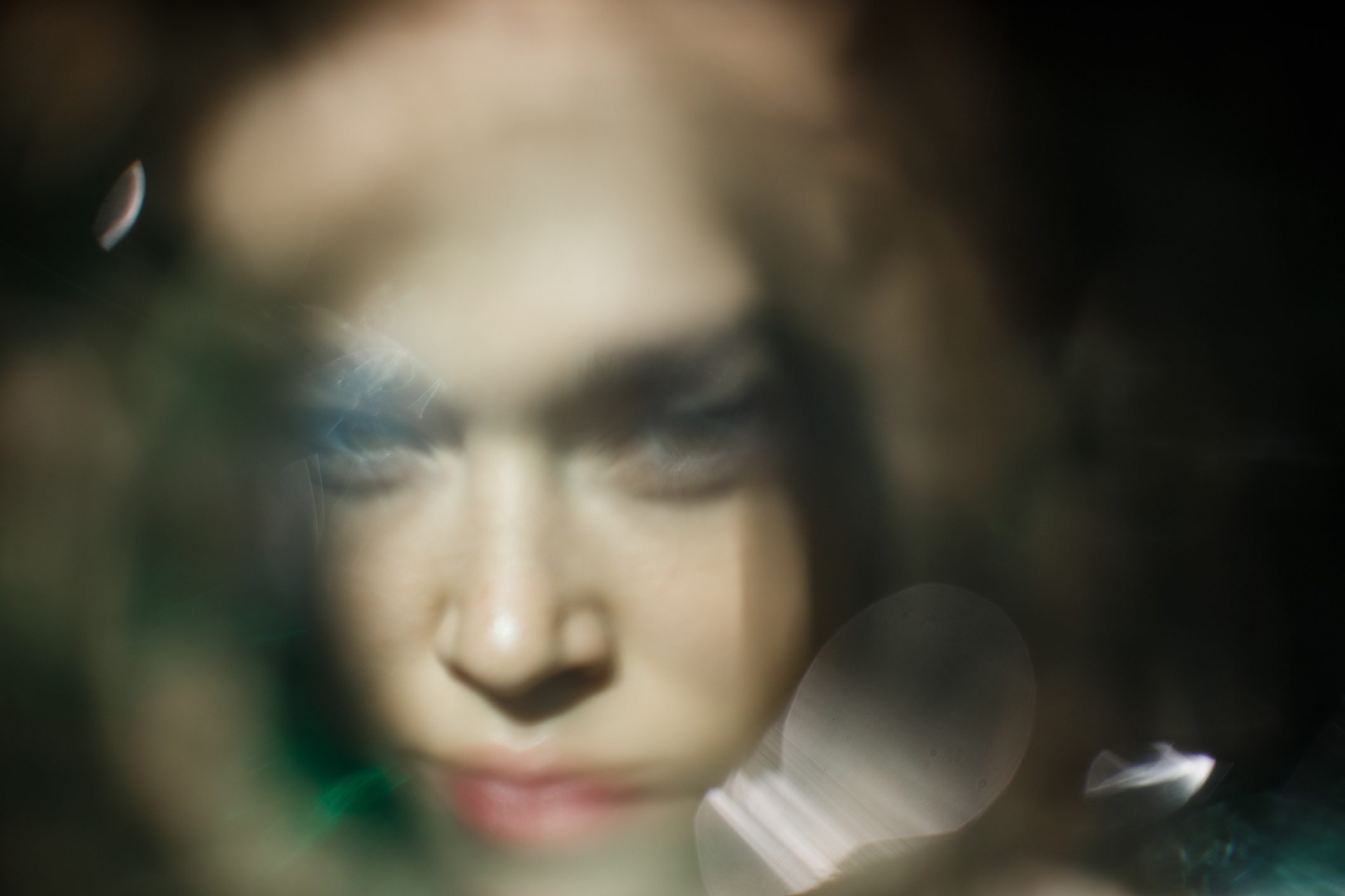 Blurred sunny portrait of the young woman